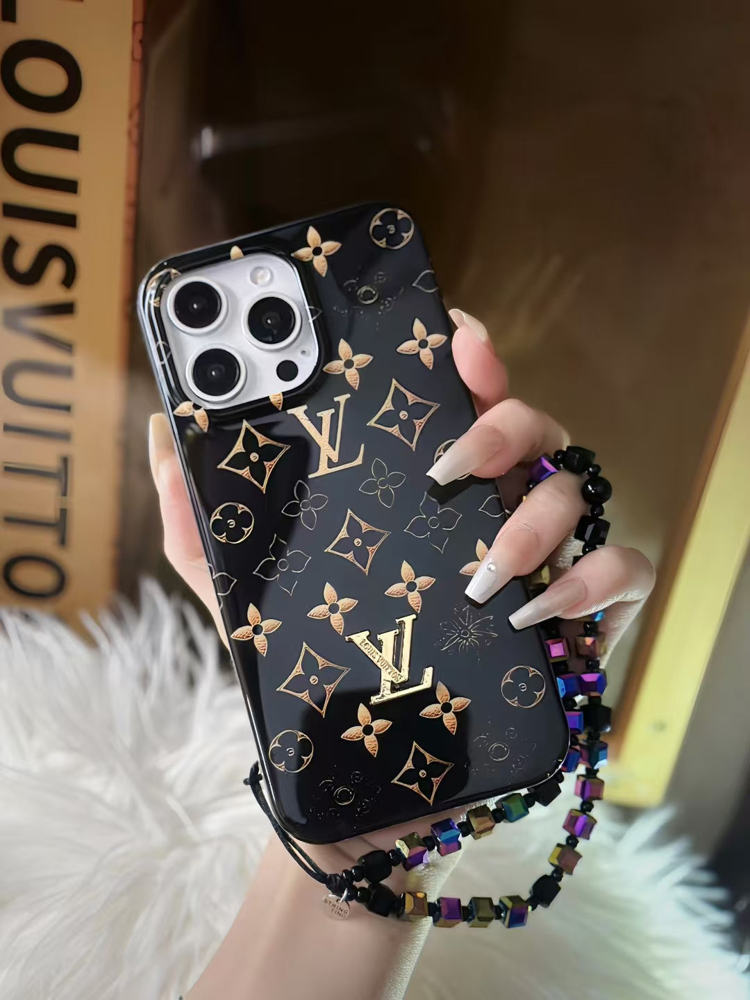 Luxury Black Monogram iPhone Case with Gold Accents and Charm Strap