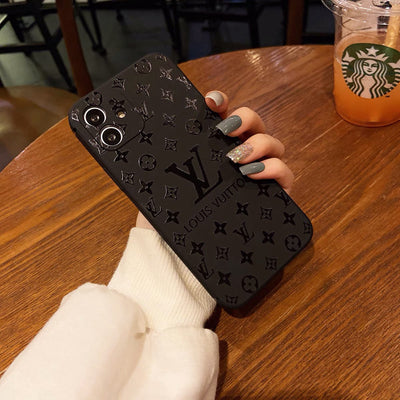 Premium black iPhone case with luxury branding